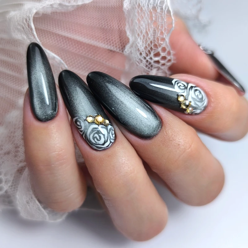 Dark grey nails with white rose motifs and gold details