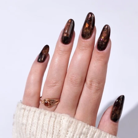 Long brown nails with amber reflections