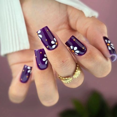 Plum nails with minimalist white floral details