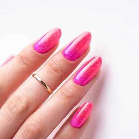 Pink nails with shimmering accents