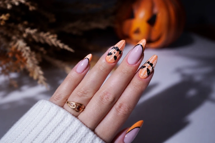 Halloween nail art with a pumpkin
