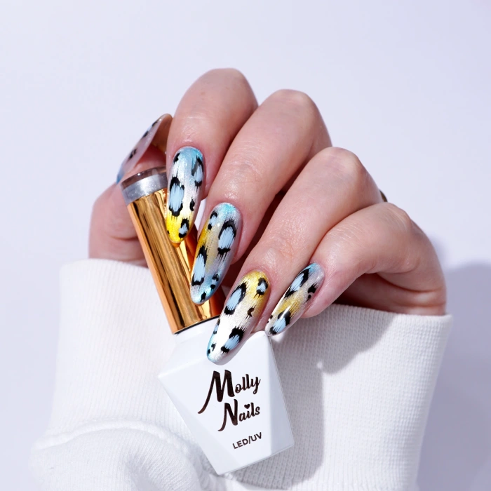 Blue and gold animal-print nails with black-and-white spots and Molly Nails gel polish